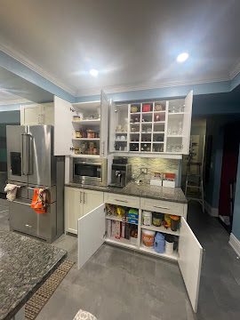 Organized craft and hobby space with categorized materials