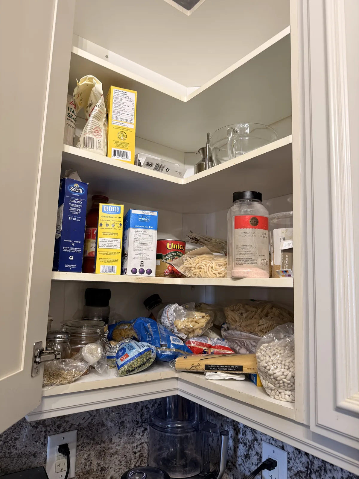 Corner pantry before professional home organizing in the GTA - Chaos Meets Order