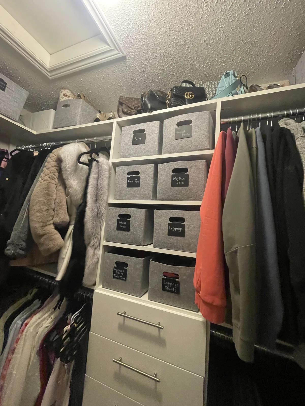 Walk-in closet after professional home organizing in the GTA - Chaos Meets Order