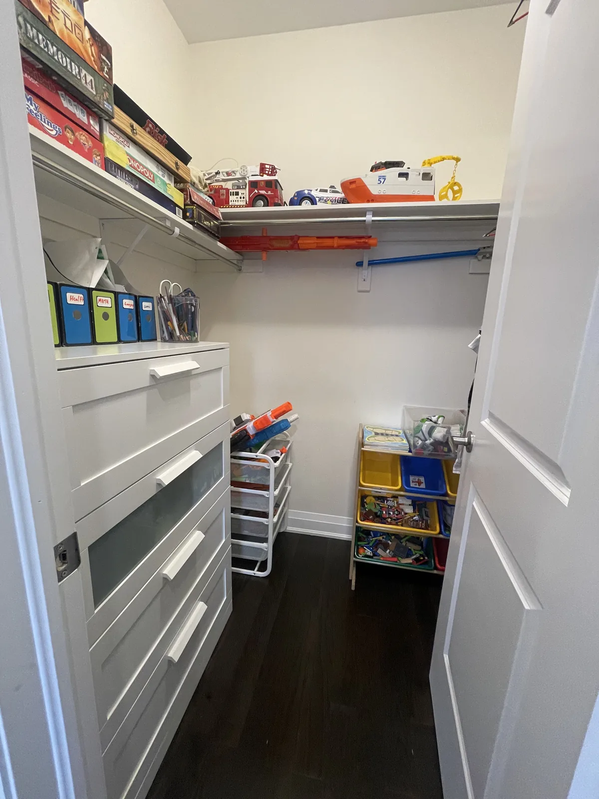 Walk-in closet after professional home organizing in the GTA - Chaos Meets Order
