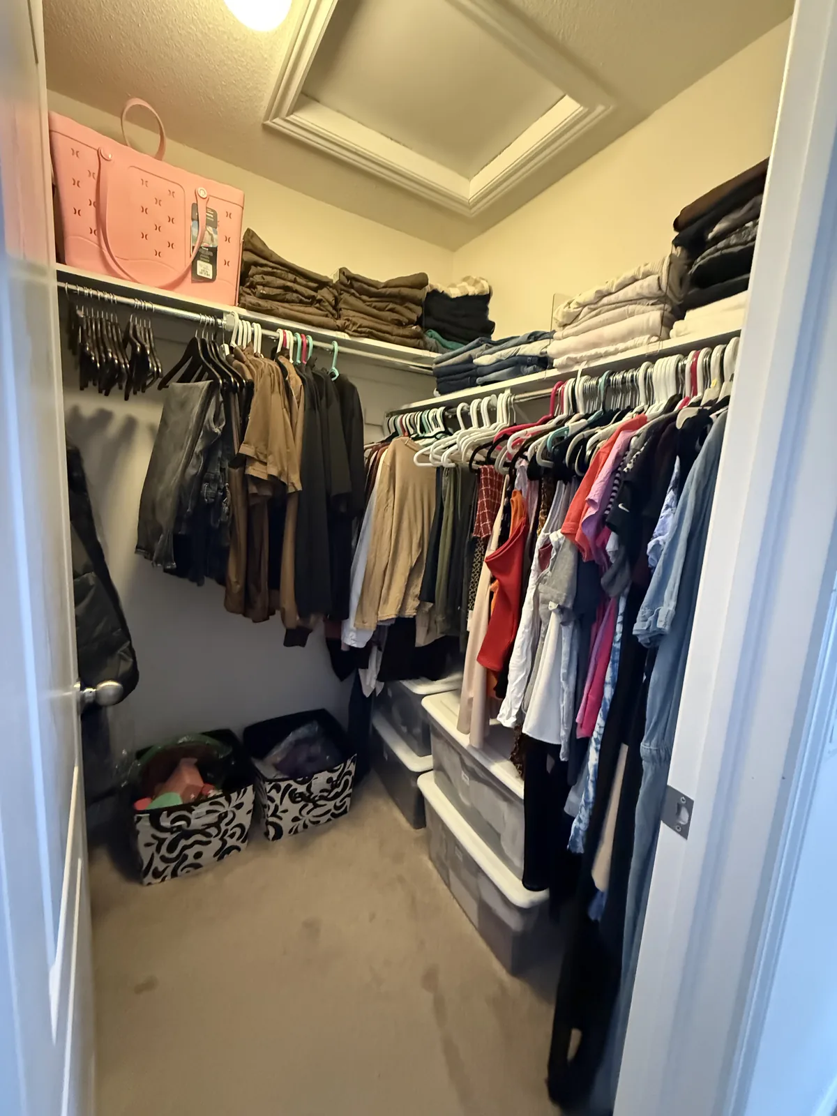 Walk-in closet after professional home organizing in the GTA - Chaos Meets Order