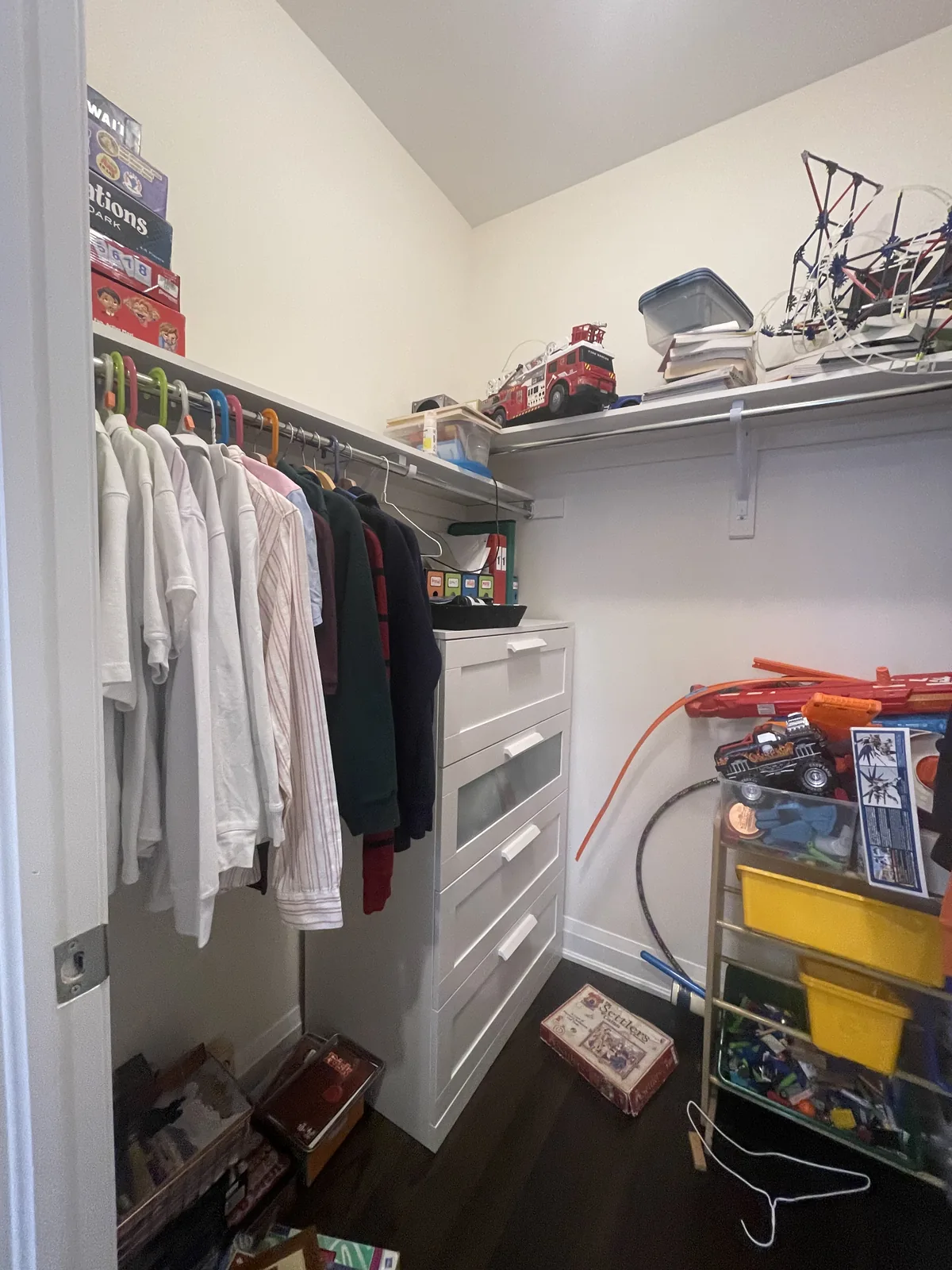Walk-in closet before professional home organizing in the GTA - Chaos Meets Order