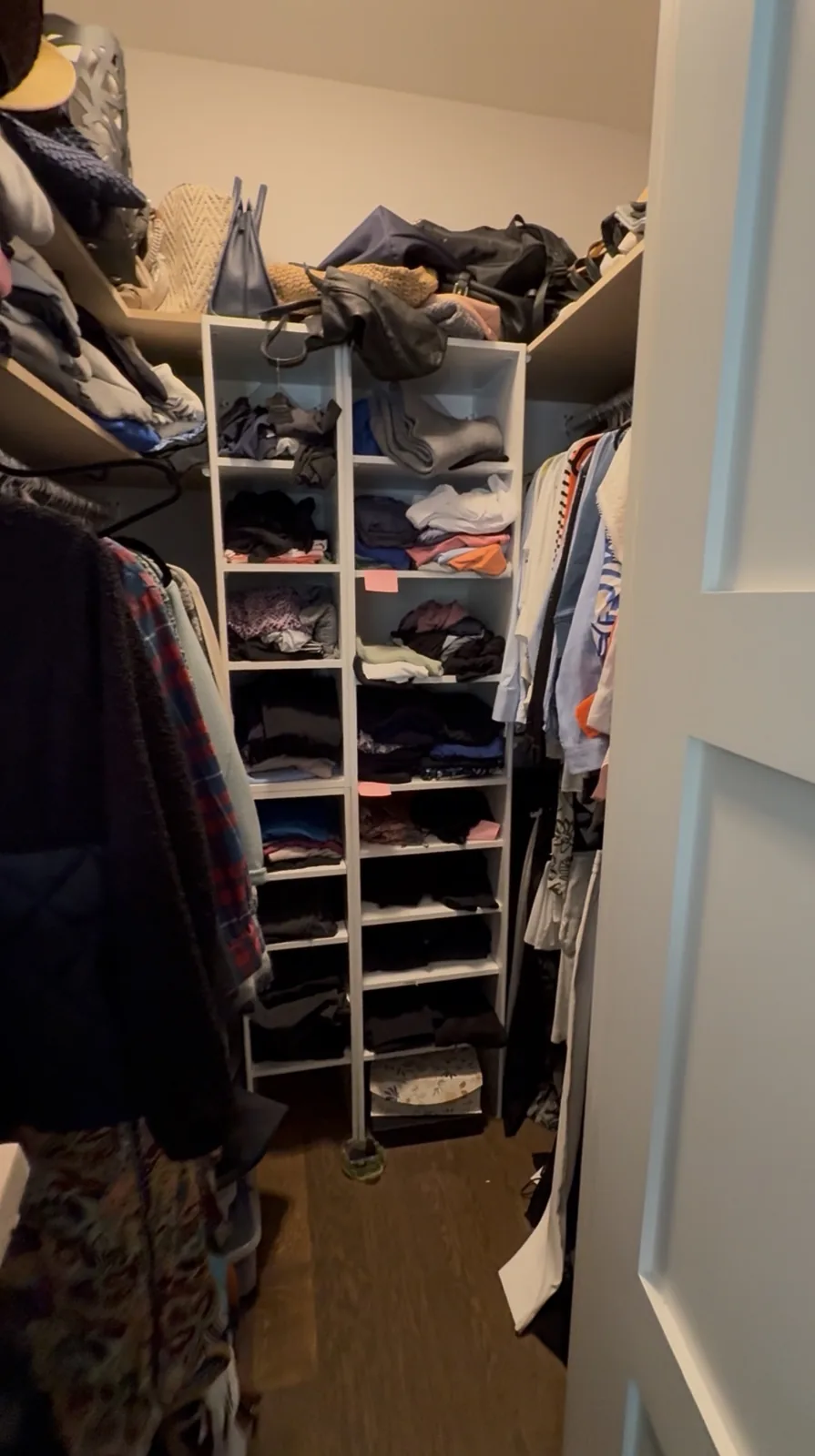 Walk-in closet before professional home organizing in the GTA - Chaos Meets Order